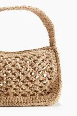 Cartera de mano tipo bolso pequeño confeccionada en paja trenzada de papel, con diseño de red, asa superior redondeada y cierre superior.