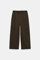 Pantalón de tiro medio con cintura elástica y pierna ancha, confeccionado en mezcla de lyocell.