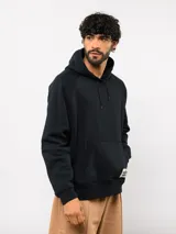 Canguro de felpa color verde menta, con capucha, bolsillo canguro frontal y etiqueta del logo Umbro en la parte delantera.