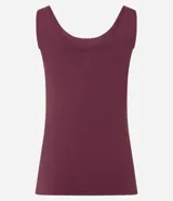 Musculosa básica de poliamida con escote en U y breteles anchos. Presenta un diseño liso, ajustado al cuerpo, confeccionado en una tela ligera, suave y de secado rápido.