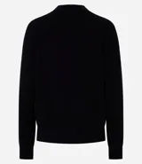 Cardigan corto de punto color marrón, con cuello en V, manga larga y cierre frontal con botones. Presenta puños y bajo acanalados.