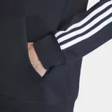 Canguro con capucha Adidas color negro, con las clásicas tres tiras blancas en las mangas y el logo del Trifolio bordado en el pecho. Cuenta con bolsillo tipo canguro y cordón ajustable en la capucha.