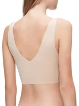 Bralette color piel de microfibra sin costuras, con copas sin relleno y breteles anchos.