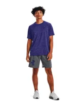 Remera deportiva Under Armour de manga corta, confeccionada en tejido técnico liviano con efecto jaspeado. Presenta cuello redondo y logo de la marca estampado en el pecho.
