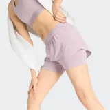 Short deportivo de mujer, color lila claro, modelo 2 en 1 con forro interior y cintura elástica.