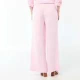 Pantalón palazzo de lino mezclado color rosa, de tiro alto con cintura elástica y corte amplio y fluido en las piernas.