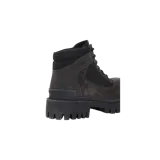 Botas de combate Balenciaga de caña baja, color negro, con diseño acordonado, suela gruesa track dentada y detalles en gamuza y lona.