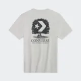 Remera celeste de algodón con cuello redondo y manga corta. Estampado en el pecho con el logo de Converse y un diseño de un árbol.