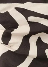 Top asimétrico de viscosa con diseño estampado animal print tipo zebra, de un solo hombro con tirante fino.