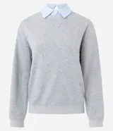 Buzo de algodón gris con cuello redondo, mangas largas con puños ajustados y aplicación de mini beads brillantes distribuidas por toda la prenda.