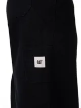 Pantalón negro de lona estilo carpintero de la marca Caterpillar, con pernera relajada y recta, bolsillos utilitarios laterales y presilla para martillo.
