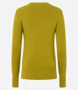 Suéter de punto ajustado con cuello redondo y manga larga. Presenta detalle de botones metalizados en los puños.