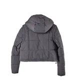 Campera multifunción modular color negro, con diseño matelaseado y capucha desmontable. Su sistema de cierres permite transformarla en cuatro versiones: campera larga, campera corta, chaleco largo y chaleco corto.