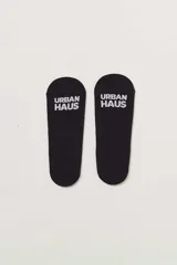 Medias invisibles de corte bajo, color negro, con diseño ergonómico y detalle de marca en la planta.