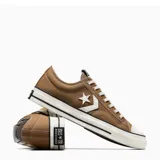 Championes Converse modelo Star Player 76 OX, color beige con detalles en blanco y negro. Presentan diseño de caña baja con el icónico logo de estrella y chevrón en el lateral, puntera de goma y suela de plataforma plana.