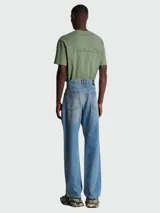 Pantalón de jean Balmain de corte holgado, color azul con efecto desgastado.