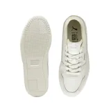 Championes Puma Carina Street SD de estilo urbano, color beige, con diseño de plataforma y detalles en gamuza. Presenta el logo de la marca en el lateral y en la suela.