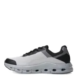 Championes deportivos unisex con diseño moderno, capellada de malla blanca y refuerzos en tono verde agua. Presentan una mediasuela voluminosa de color celeste con orificios laterales para mayor amortiguación y suela negra.