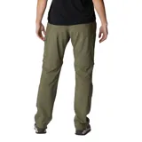 Pantalón convertible Columbia de corte recto en color verde oliva. Presenta diseño funcional con perneras desmontables mediante cremallera para convertirlo en short, múltiples bolsillos laterales y traseros, y tecnología de protección solar.