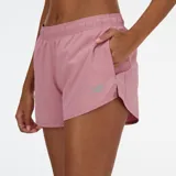 Short de running color rosa con cintura elástica y logo reflectivo.