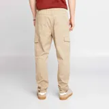 Pantalón de jogging color beige con bolsillos cargo con solapa.