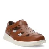 Sandalias tipo cerradas de cuero color marrón coñac, con diseño troquelado en la parte superior, cierre de velcro lateral y suela de goma blanca.