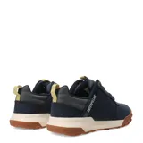 Championes urbanos Caterpillar modelo Hex Ready Lo, color azul marino con suela de goma color caramelo y entresuela beige. Presenta detalles en color crema en la lengüeta y el talón, con cordones jaspeados y logo de la marca en el lateral.