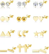 Set de nueve pares de aros dorados con diferentes diseños: cristal, círculo, esfera, corazón, triángulo, luna, estrella, barra y cruz.