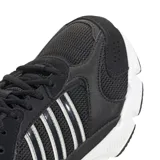 Championes adidas modelo Crazychaos 2000, de diseño deportivo en color negro con detalles en blanco. Presentan una estructura de malla y materiales sintéticos, con las icónicas tres tiras laterales en contraste y una entresuela con tecnología Cloudfoam para mayor amortiguación.