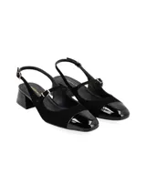Zapato destalonado Beia de cuero y cuero charol color negro, con taco medio cuadrado, punta cuadrada y dos tiras finas con hebilla metálica sobre el empeine y el talón.