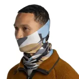 Cuello multifuncional Buff modelo Thermonet, confeccionado con fibras aislantes PrimaLoft y tejido transpirable. Presenta un diseño sin costuras con elasticidad en cuatro direcciones y un estampado geométrico en tonos beige, azul, gris y negro.