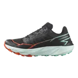 Championes de trail running Salomon Thundercross, color negro con suela verde menta y detalles en naranja. Cuentan con tacos agresivos de 5 mm, amortiguación dinámica y sistema de ajuste preciso.