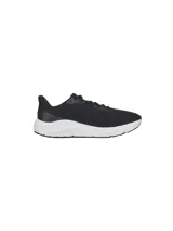 Championes de running Under Armour modelo Charged Pursuit 4, color negro con suela blanca. Presentan una parte superior de malla transpirable, acolchado en el tobillo y entresuela Charged Cushioning para mayor amortiguación y respuesta.