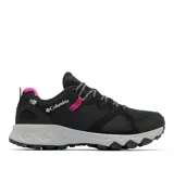 Championes de senderismo Columbia modelo Peakfreak Hera, color negro con detalles en fucsia y suela gris. Presentan tecnología impermeable OutDry, sistema de ajuste Navic Fit y suela Adapt Trax para mayor tracción.