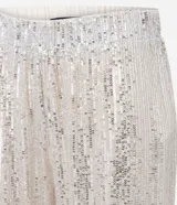 Pantalón pantalona confeccionado en tejido de punto abierto con elástico en la cintura y lentejuelas metalizadas aplicadas.