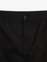 Falda cargo larga de corte recto en color negro, con cintura elástica ajustable mediante cordones y ruedo regulable con tiras laterales. Presenta un diseño funcional con bolsillos tipo cargo.