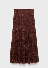 Falda larga de tiro medio con diseño evasé y estampado paisley en tonos marrones y negros. Cuenta con cierre de cremallera en la parte posterior y forro interior.