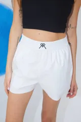 Bóxer confeccionado en poplín de algodón con cintura elástica ancha y logo doble R bordado en la parte delantera.