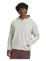 Buzo deportivo de media cremallera Under Armour, color beige claro, con capucha, bolsillos laterales con cierre y puños elásticos. Confeccionado en tejido técnico elástico de alto rendimiento.