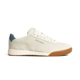 Championes Skechers Zinger 2.0, de estilo retro con capellada de cuero sintético color crema, detalles grabados y plantilla acolchada Skechers Air-Cooled Memory Foam. Suela de goma color caramelo y detalle azul en el talón.