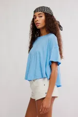 Remera corta de corte relajado y silueta holgada de la colección We The Free, confeccionada en una mezcla de lino y algodón con acabado jaspeado y cuello redondo.