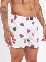 Bóxer de algodón blanco con estampado de flores pequeñas color celeste, con cintura elástica y logo de la marca en el centro.