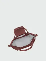 Cartera de mano Longchamp modelo Le Pliage One talla S, color amarillo, con solapa de cuero y cierre de botón a presión, asas cortas de mano y cierre superior con cremallera.