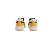 Championes Puma modelo CA Pro Sport, con diseño de caña baja, combinación de colores blanco, amarillo y negro, con el logo de la marca en el lateral y suela de plataforma.