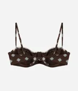 Top de bikini media copa con aro, confeccionado en poliamida con estampado Sunshine Icon de motivos geométricos celestes sobre fondo marrón, breteles finos regulables y detalle de costuras en contraste.