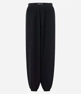 Pantalón modelo aladino de corte holgado, confeccionado en crepé negro. Presenta cintura elástica y puños elásticos en el bajo, con un diseño de volumen tipo globo.