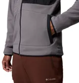 Campera de polar Columbia con cierre frontal completo, cuello alto y bolsillo en el pecho con cierre y panel de contraste. Presenta ribetes elásticos en puños y dobladillo.