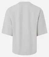 Blusa de corte oversized, color negro, con cuello redondo y mangas cortas. Confeccionada en una mezcla de poliéster y algodón.