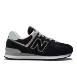Championes urbanos New Balance modelo 574, color negro con detalles en gris y blanco, confeccionados en gamuza y malla, con logo "N" característico en los laterales y entresuela ENCAP.