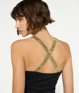 Musculosa blanca de algodón orgánico con tirantes finos cruzados de lurex plateado en la espalda.